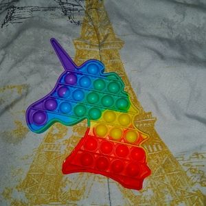 A rainbow unicorn pop it